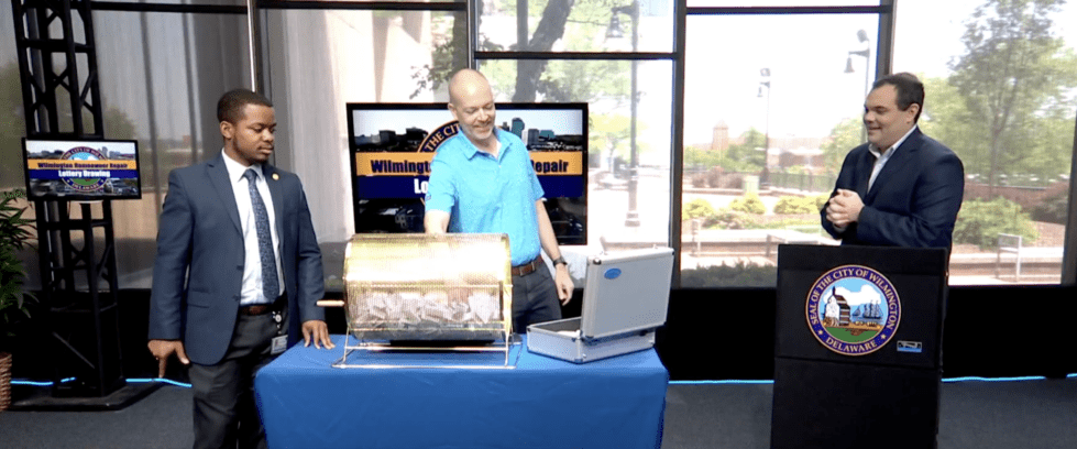 Wilmington City Council members pull the winning lottery numbers for the Senior Home Repair Lottery. (Photo WITN Channel 22)